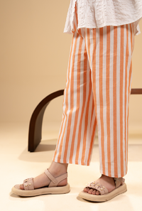 Stylish Peplum-Cut Top Paired With Striped Trousers