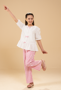 Stylish Peplum-Cut Top Paired With Striped Trousers