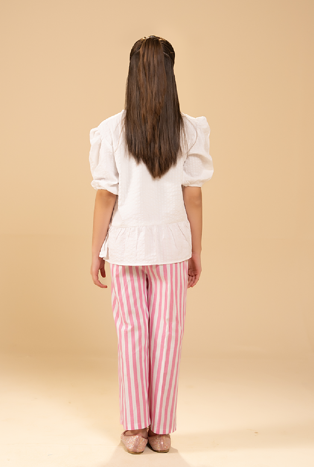 Stylish Peplum-Cut Top Paired With Striped Trousers