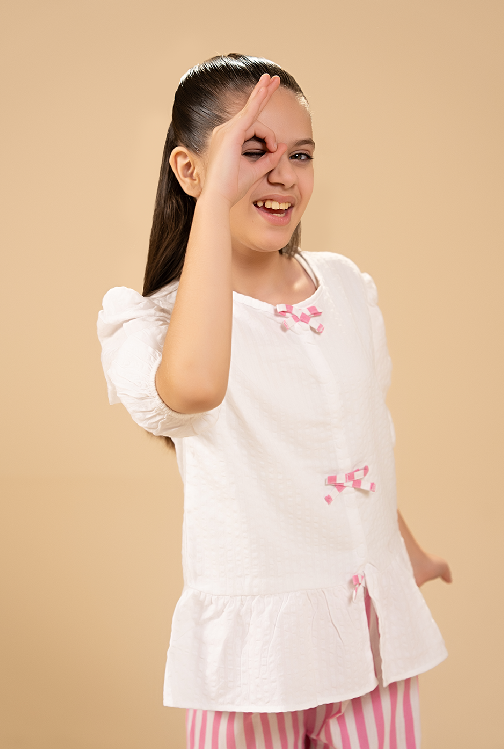 Stylish Peplum-Cut Top Paired With Striped Trousers