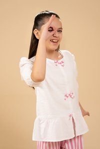 Stylish Peplum-Cut Top Paired With Striped Trousers