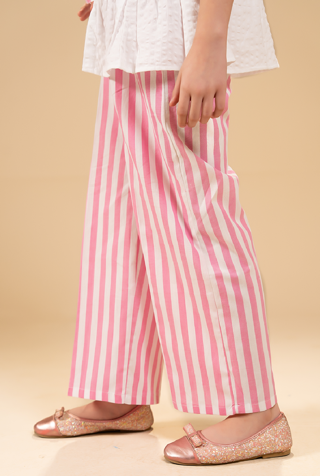 Stylish Peplum-Cut Top Paired With Striped Trousers